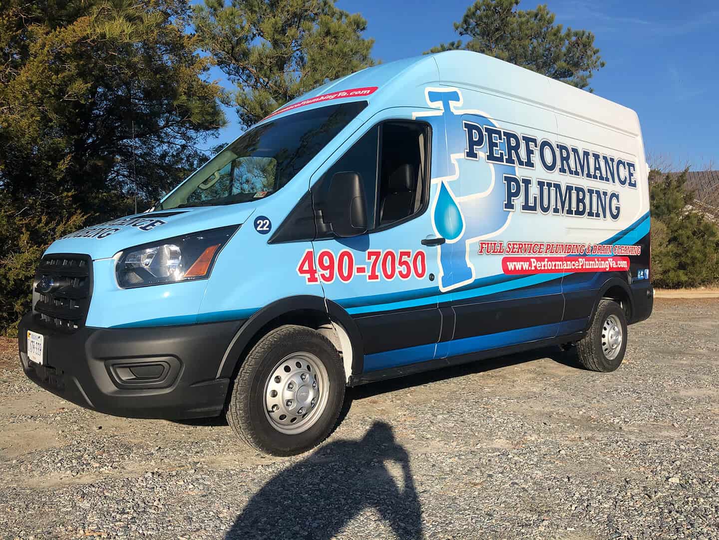 Custom van wrap for Performance Plumbing (front and side view)