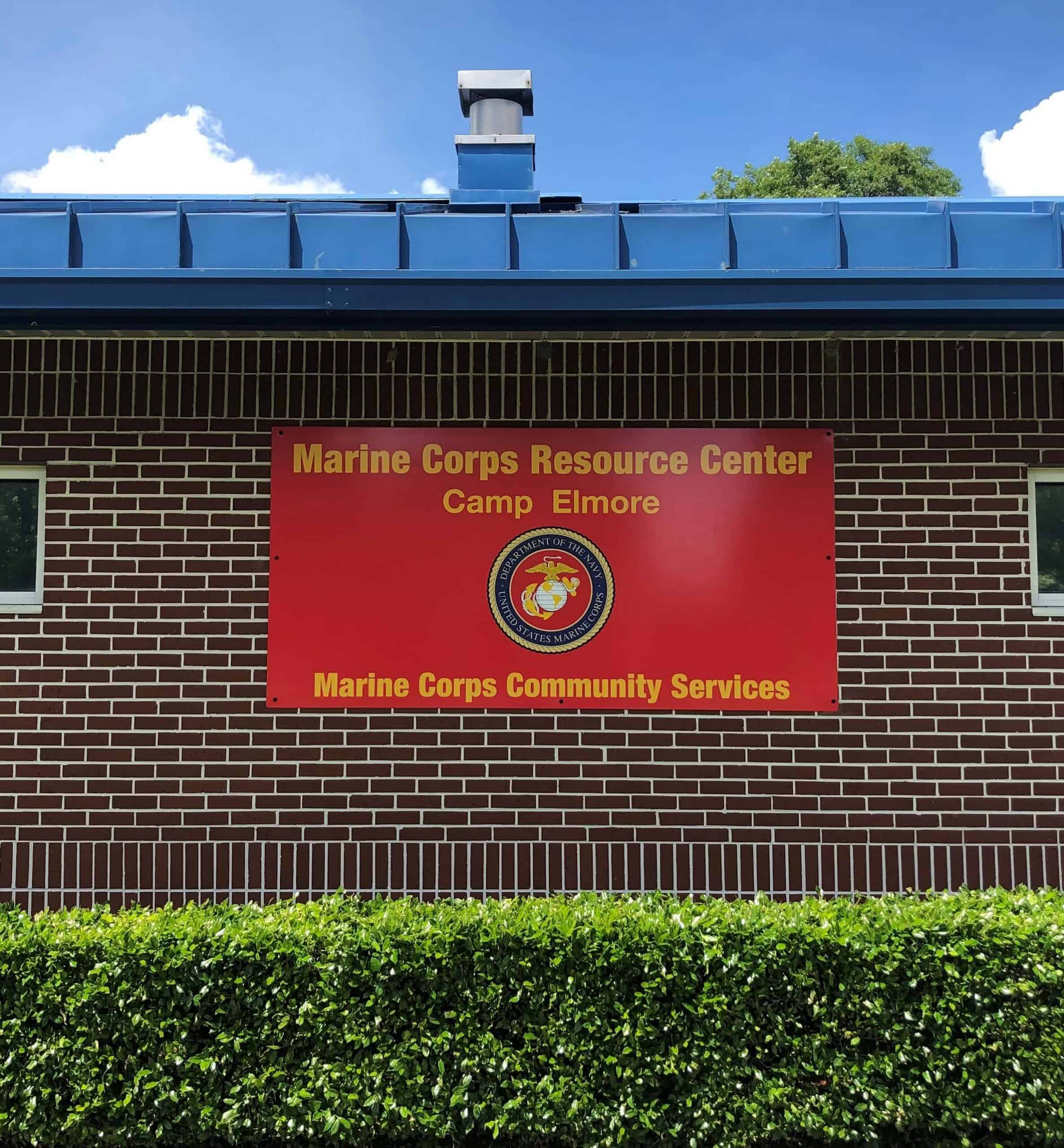 Mounted sign on brick for MCCS Community Services Camp Elmore