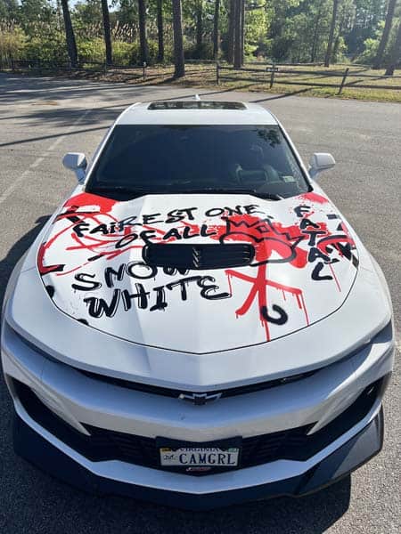 Snow White grunge style hood graphics on car from DeSigns, Inc.