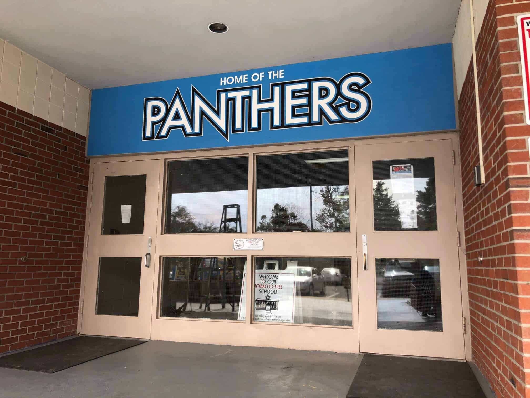High school sports team murals