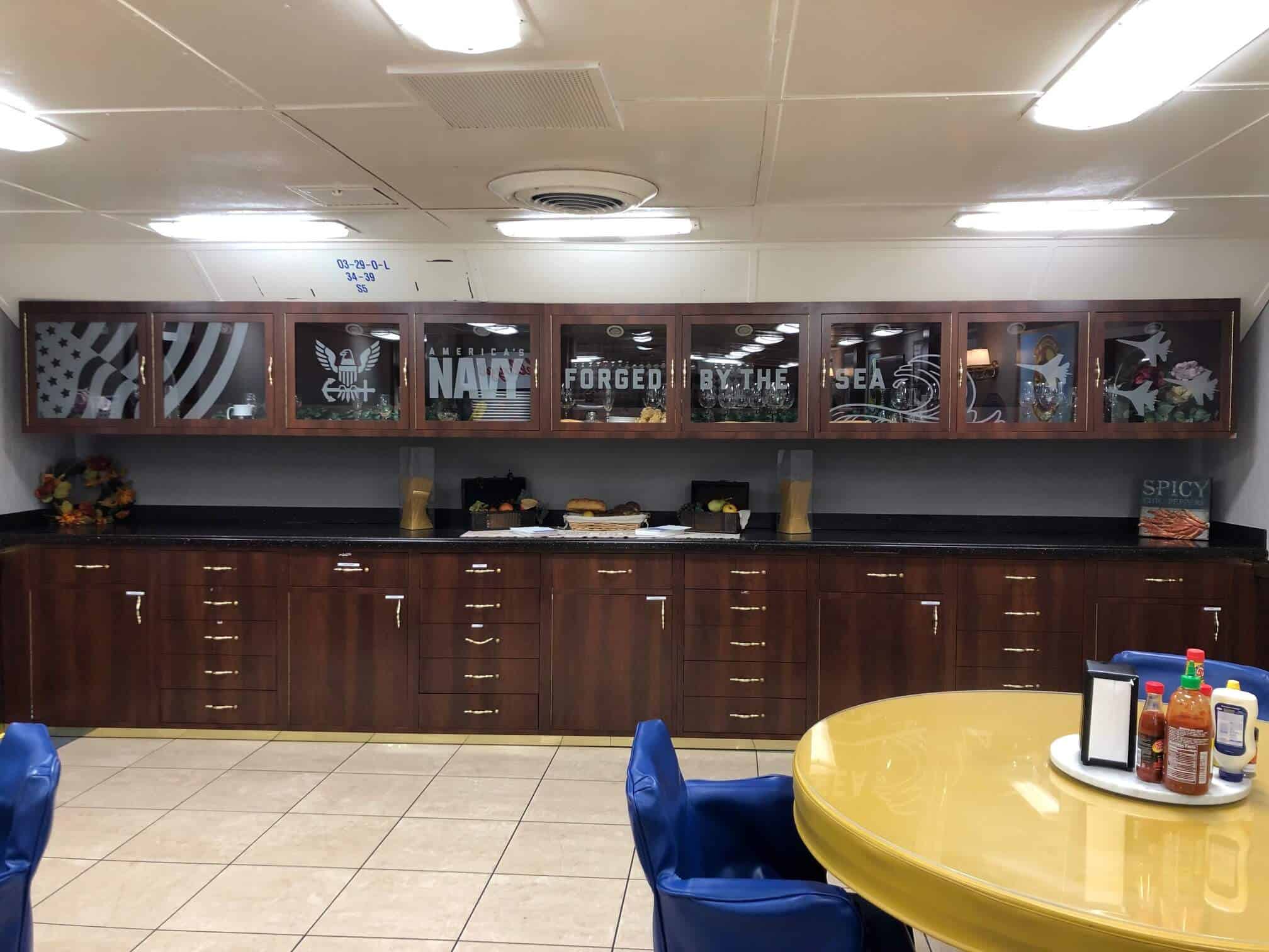 Etch glass on cabinets in mess hall for U.S. Navy by DeSigns, Inc.