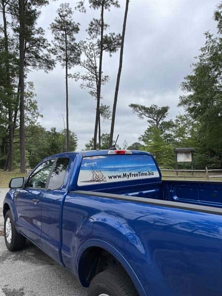 Perforated rear window film graphics on pickup truck from DeSigns, Inc.