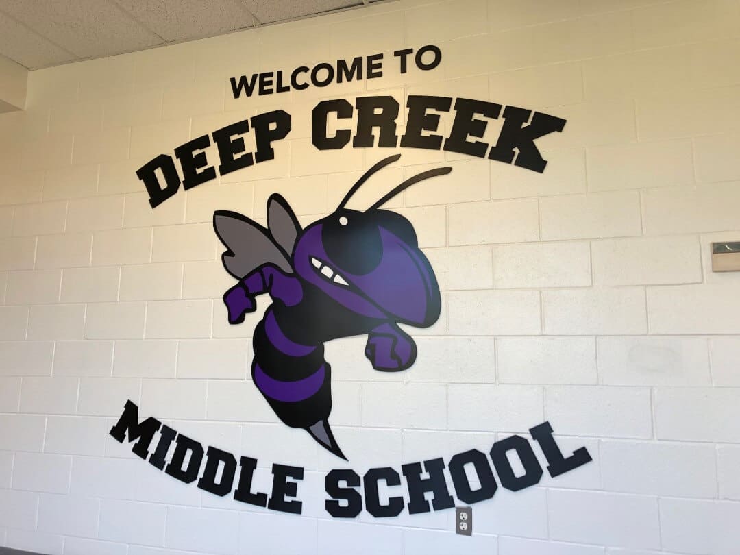 School entrance sign, Get sign graphics added to most any surface.