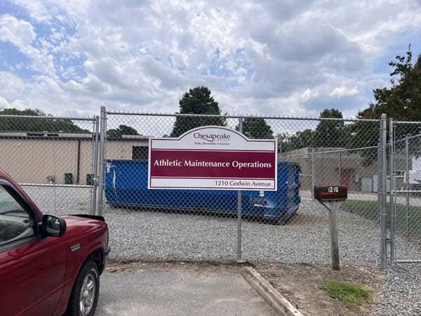 Signs installed on chain link fence from DeSigns, Inc. for signs, banners, wraps, and promotional products.