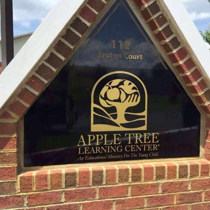 Lettering and logo on glass sign for-Apple Tree Learning Center