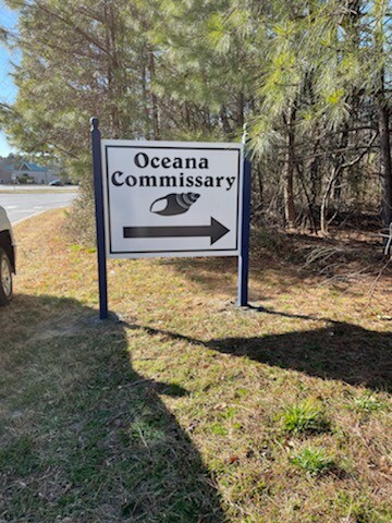 Wood building signs installed by DeSigns Inc. for Oceana Commissary