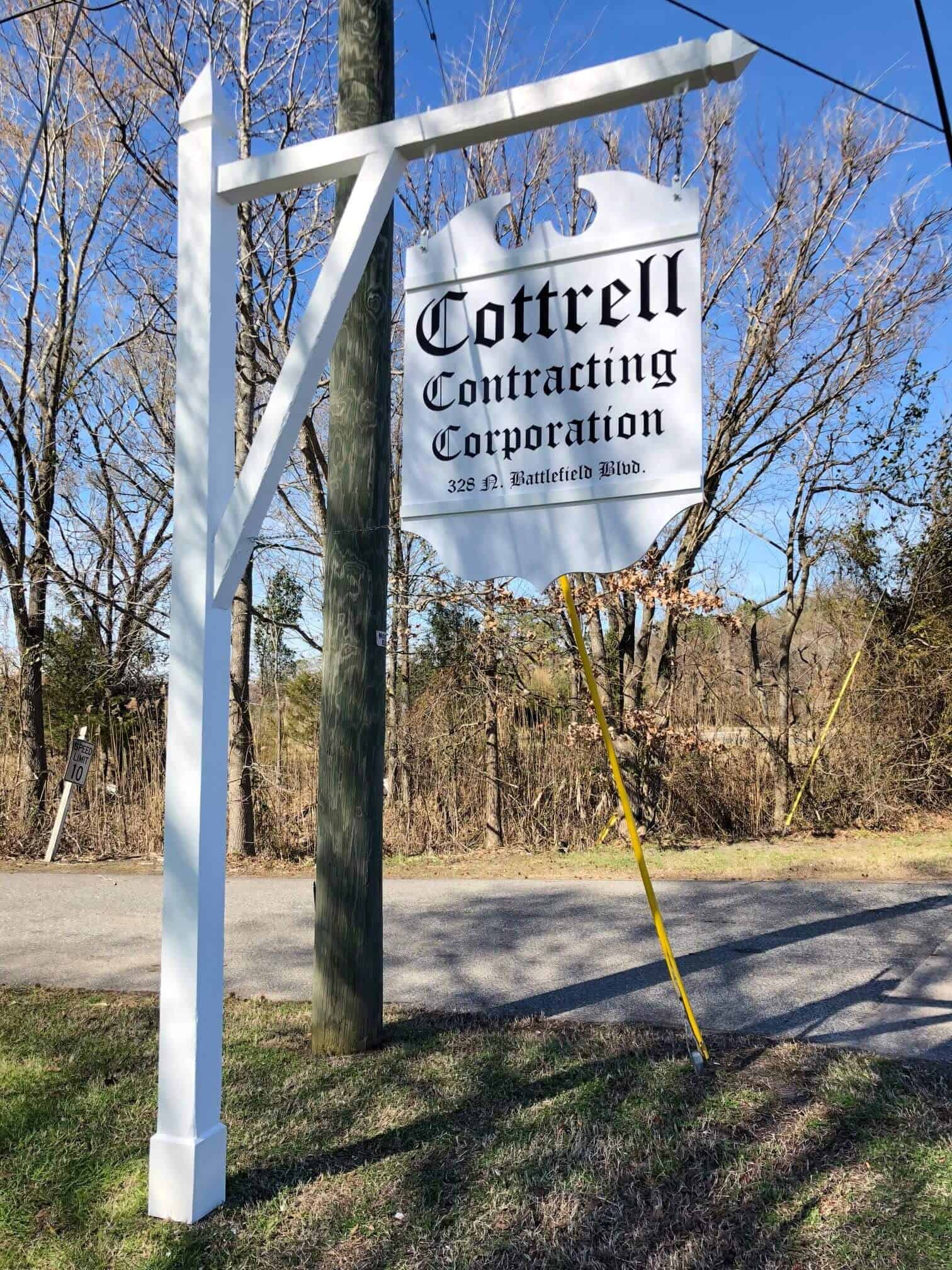 Tall hanging suspended signs - Directory signs - Hanging sign for Cottrell Contracting Corp.