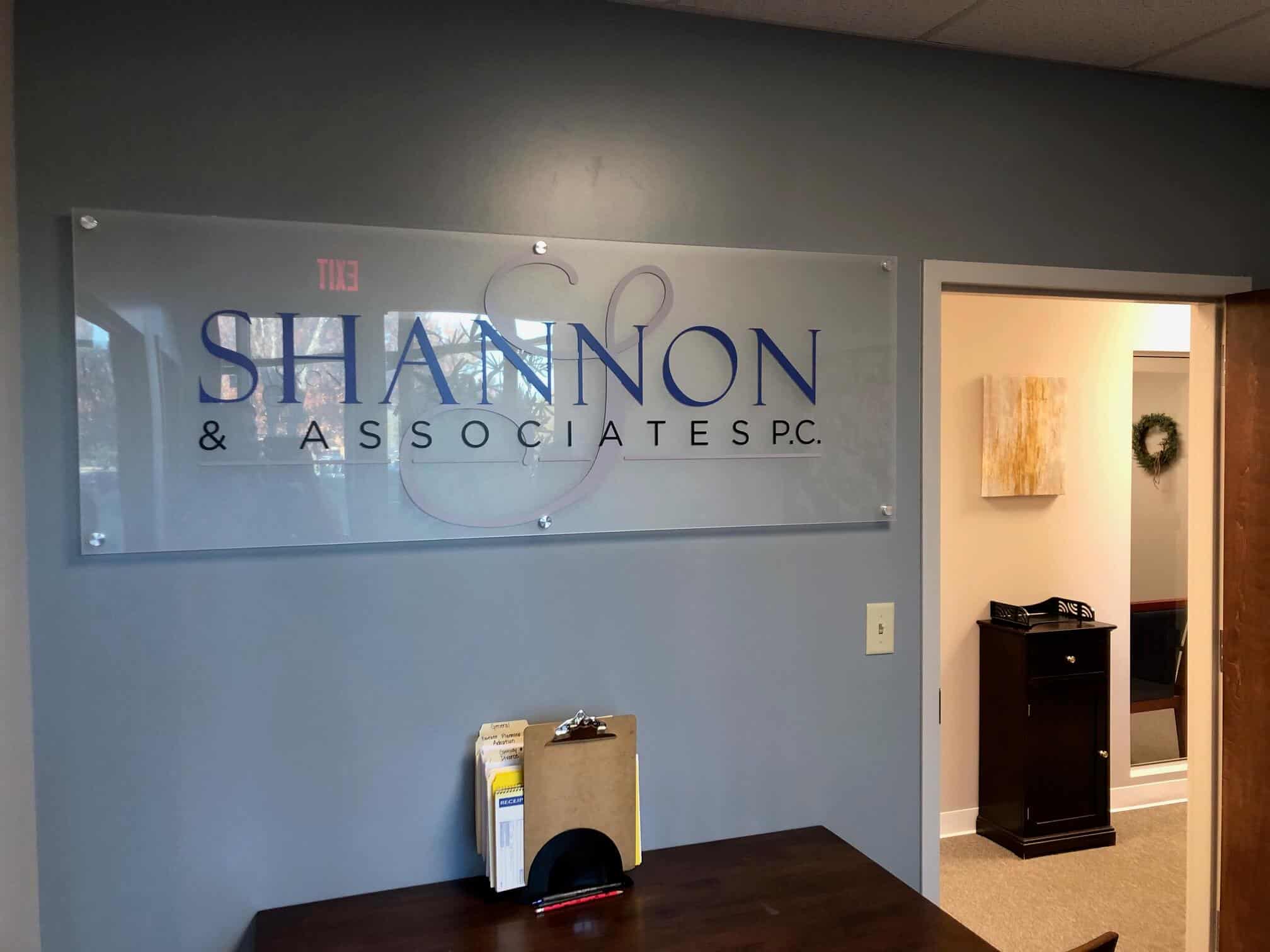 Etched plexiglass interior lobby signs by DeSigns, Inc.