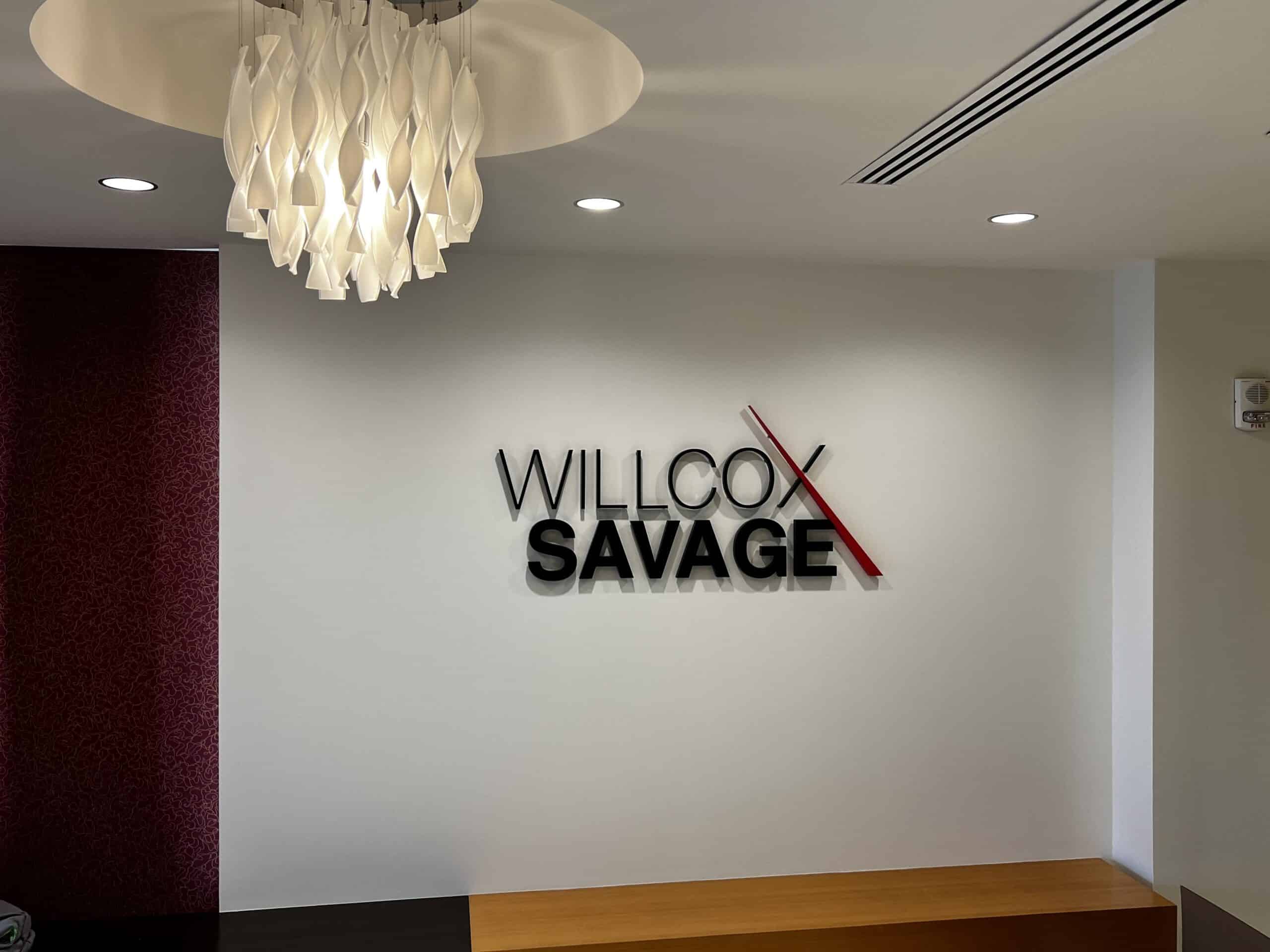 Logos mounted on office lobby walls - Fabricated metal letters for reception by DeSigns, Inc.