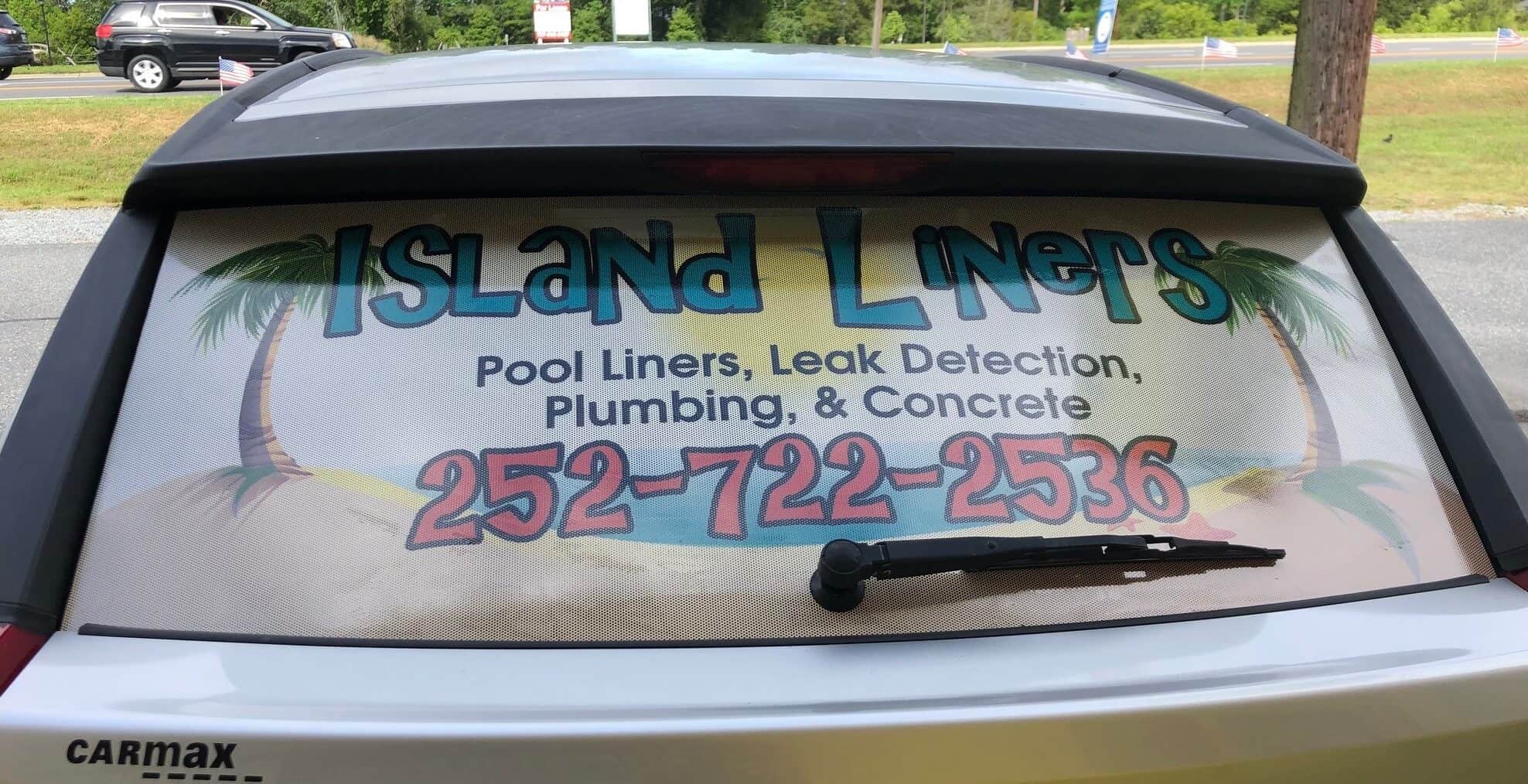 Perforated window film graphics on rear window of car for Island Liners